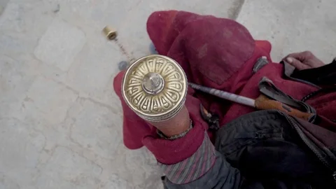 Tibetan Monk using the Prayer Wheels at Ladakh, India - Slow Motion Stock Footage 114208785