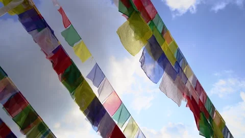 Tibetan Prayer Flags Against Blue Sky at Boudhanath Stupa Stock Footage 338331760