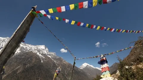 Tibetan prayer flags blowing in wind with Himalaya Mountains in background 스톡 동영상 101444067
