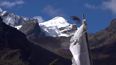 Tibetan prayer flags on high posts with himalaya mountain, 2023 Stock Footage 277661033