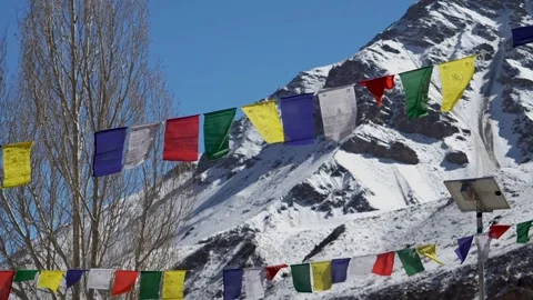 Tibetan Prayer Flags Waving in Wind Snowy Himalayan Mountain Stock Footage 331765112