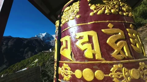 Tibetan Prayer Wheel Rotating with Mt. Kongde in Nepalese Himalayas. Stock Footage 235142654