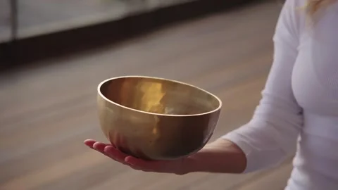 Tibetan singing bowl close-up. Meditation using metal nepal singing bowls Stock Footage 303692853