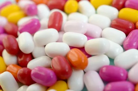 Tic tac hard mints pattern close up. Tic tac is popular due its minty fresh t Stock Photos