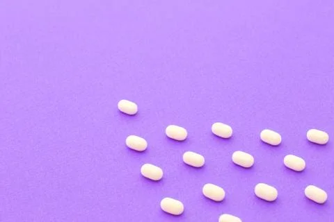 Tic tac sweets on violet background Stock Photos