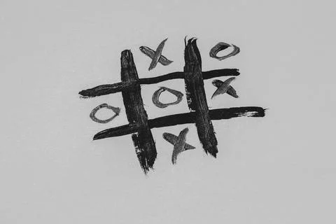 Tic-tac-toe drawn with a brush on a white background, board game Stock Photos