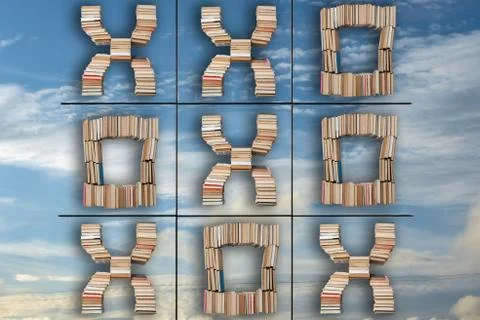 Tic tac toe game on sky background reflecting in a window. Concept of success Stock Photos