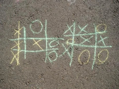 Tic Tac Toe Games Drawn with Chalk on Asphalt Stock Photos