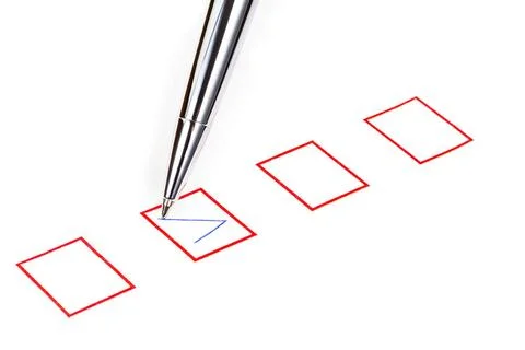 Tick in red square box tick in red square box by silver metal pen Copyrigh... Stock Photos