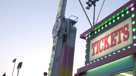 Ticket Booth with Carnival Ride in the Background Stock Footage 76238553