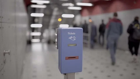 Ticket validator for public transport in blue color on background walking Stock Footage 253573523