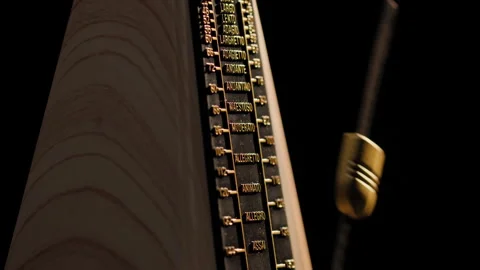 Ticking metronome pendulum Close up Stock Footage 301915857