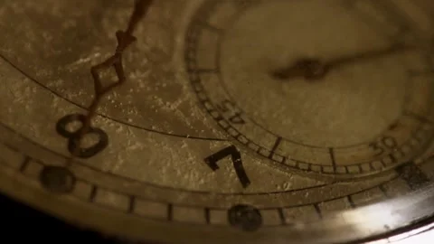 Ticking second hand moves over a dusty watch face Stock Footage 329595875