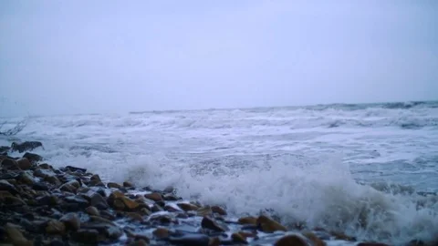 Tidal bore. Pebbles on the shore Stock Footage 74488190