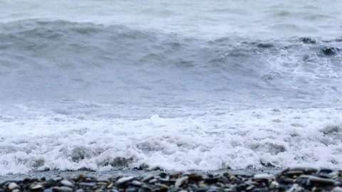 Tidal bore. Pebbles on the shore Stock Footage 74488903