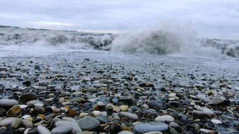 Tidal bore. Pebbles on the shore Stock Footage 74494064