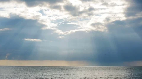 Tidal bore. Sunset at sea, the rays of the sun make their way through the clouds Stock Footage 73753331