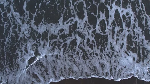 Tidal bore. top view of the sea waves on the beach Stock Footage 240999892