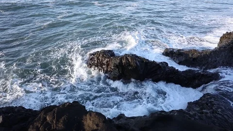 Tidal bore. Waves beat on the rocks 動画素材 95969501