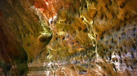 A tidal cave pool reflects beautiful light onto cave walls in jungle of Borneo. Stock Footage 32542734
