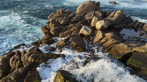 Tidal Force: The Ocean's Rush Against the Rocky Shores Stock Footage 266831907