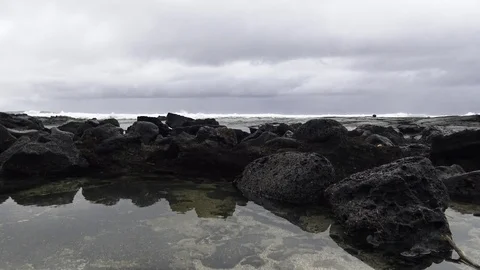 Tidal pool and black lava rock on the ocean Stock Footage 81642730