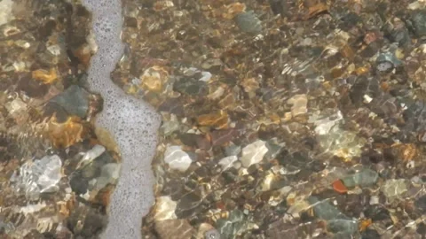 Tidal waves on beach pebbles Stock Footage 319805824