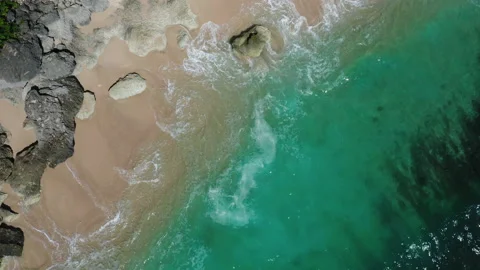 Tidal waves breaking along the coast Stock Footage 155177682