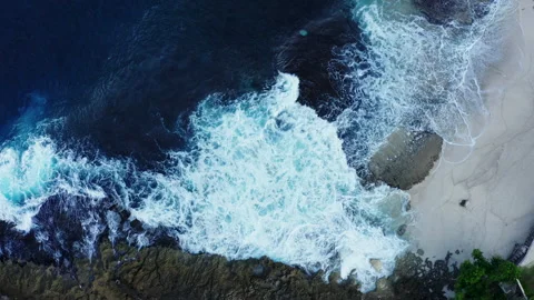 Tidal waves breaking along the shore Stock Footage 155835676