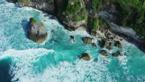 Tidal waves breaking on a cliff in Bali Stock Footage 147906680
