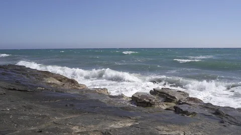 Tidal waves breaking on a rocky shore of Ancient Amathus archaeological site Stock Footage 112947798