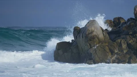 Tidal Waves Crashing Over Jagged Rocks Stock Footage