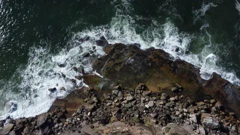 Tidal Waves Crashing Over Jagged Rocks, Aerial Footage Stock Footage 239575097