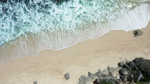 Tidal waves splashing on a white sand beach in Bali Stock Footage 132609532
