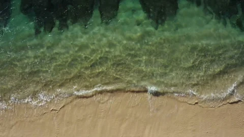 Tidal waves splashing on a white sand beach in Bali Stock Footage 132611651