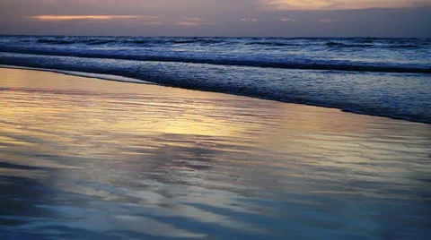 Tide on beach at spectacular sunset Stock Footage 18191531