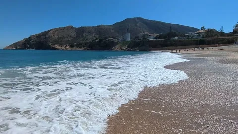 Tide coming in and out at sandy beach in ALtea Spain Stock Footage 306242276
