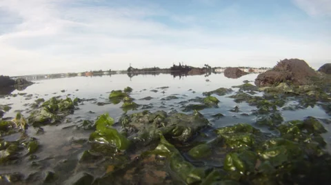 Tide going out camera submergered 01 Stock Footage 33891655