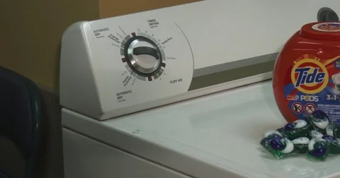 Tide Laundry Pods - Pan - In Laundry Room Stock Footage 85443200