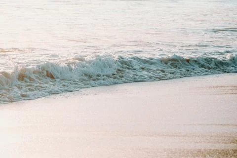 Tide over the sand beach during a bright day with a lot of copy space Foto stock