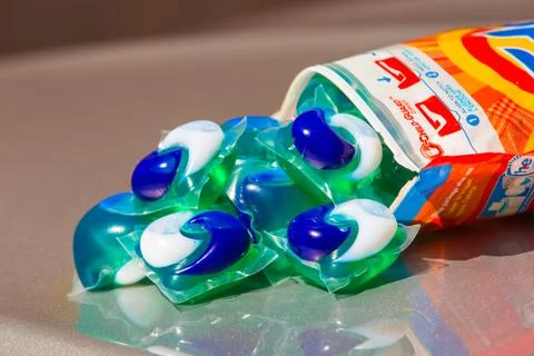 Tide pods with laundry detergent Stock Photos