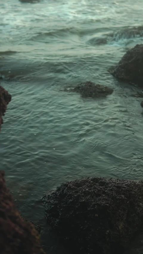Tide Pool Waves Flowing Over Rocky Shoreline in Coastal Nature Scene Stock Footage 337912027