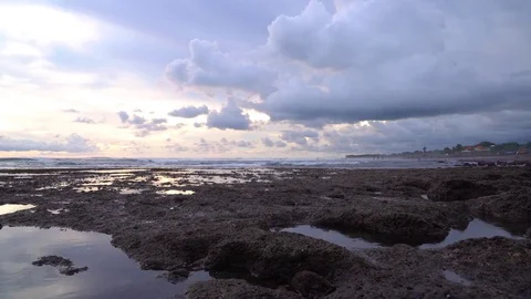 Tide pools in front of a cloudy sunset Video stock 74290411