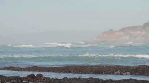 Tide Pools with Waves Crashing and Cliffs in the Background, Moss Beach CA Stock Footage 167716054