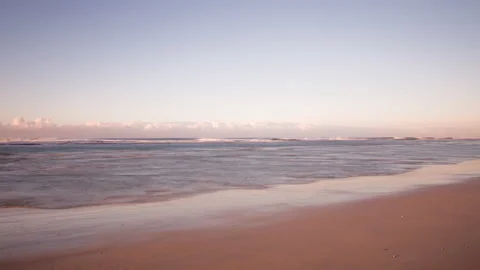 Tide Receding Timelapse On Pristine Beach With Distant Clouds Rolling Video stock 153374789