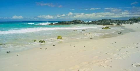 Tide Rolling In On Sandy Tropical Beach Stock Photos