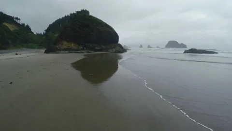 Tide washing onto a beach Stock Footage 154920843