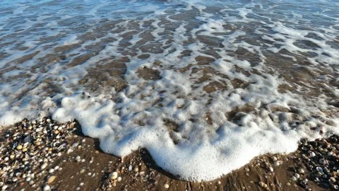 Tide, waves lapping on the beach. Video stock 184641805