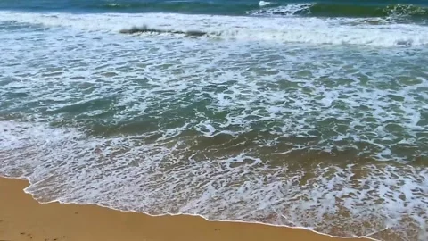 Tide waves on the ocean on a warm vacation day. Stock Footage 154375351