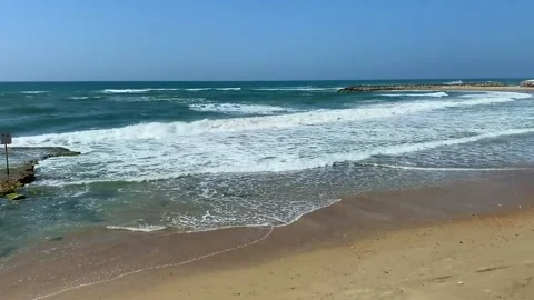 Tide waves on the ocean on a warm vacation day. Stock Footage 154378102